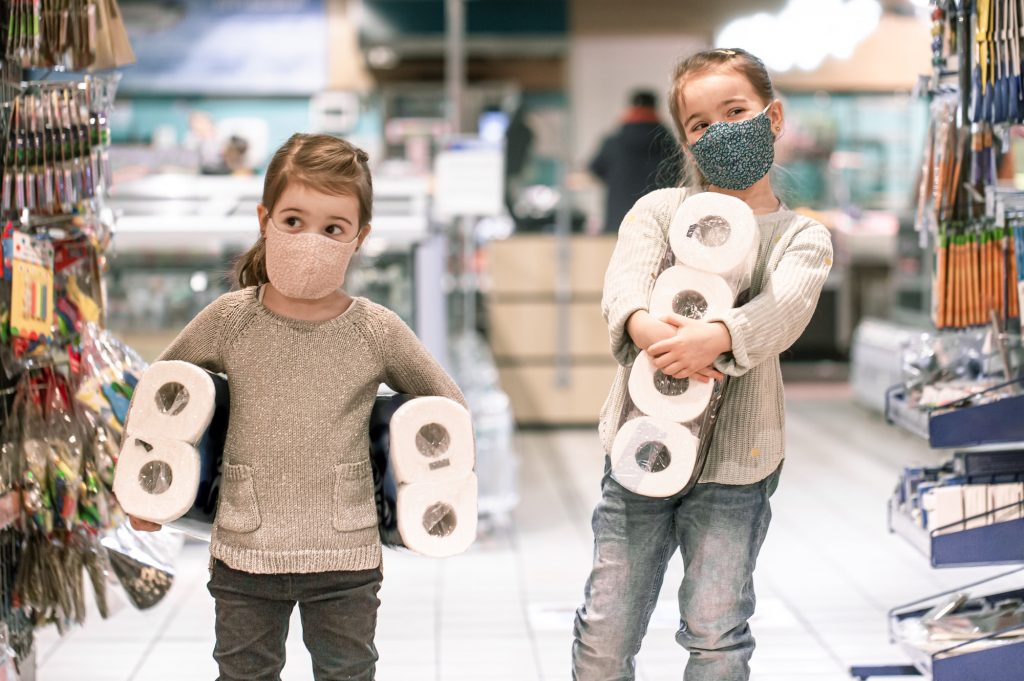Children shopping at the supermarket during the pandemic .
